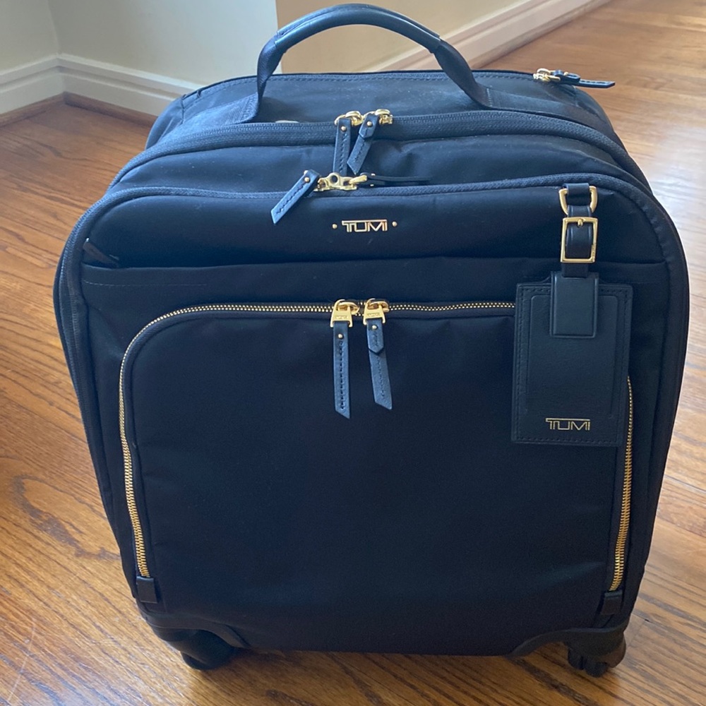 Tumi rolling computer bag & gold zipper accents. Fits up to 14” computer. NWOT